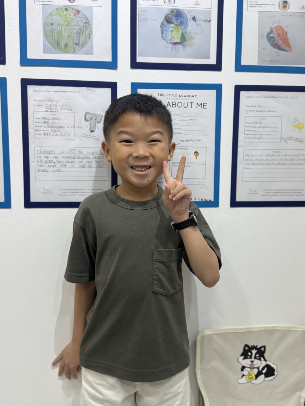 Student smiling with a peace sign at The Lit Adventure
