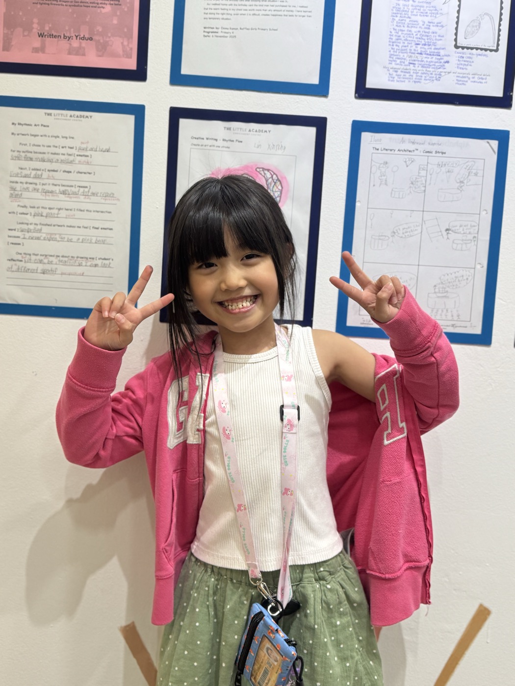 Student smiling with a peace sign at The Lit Adventure