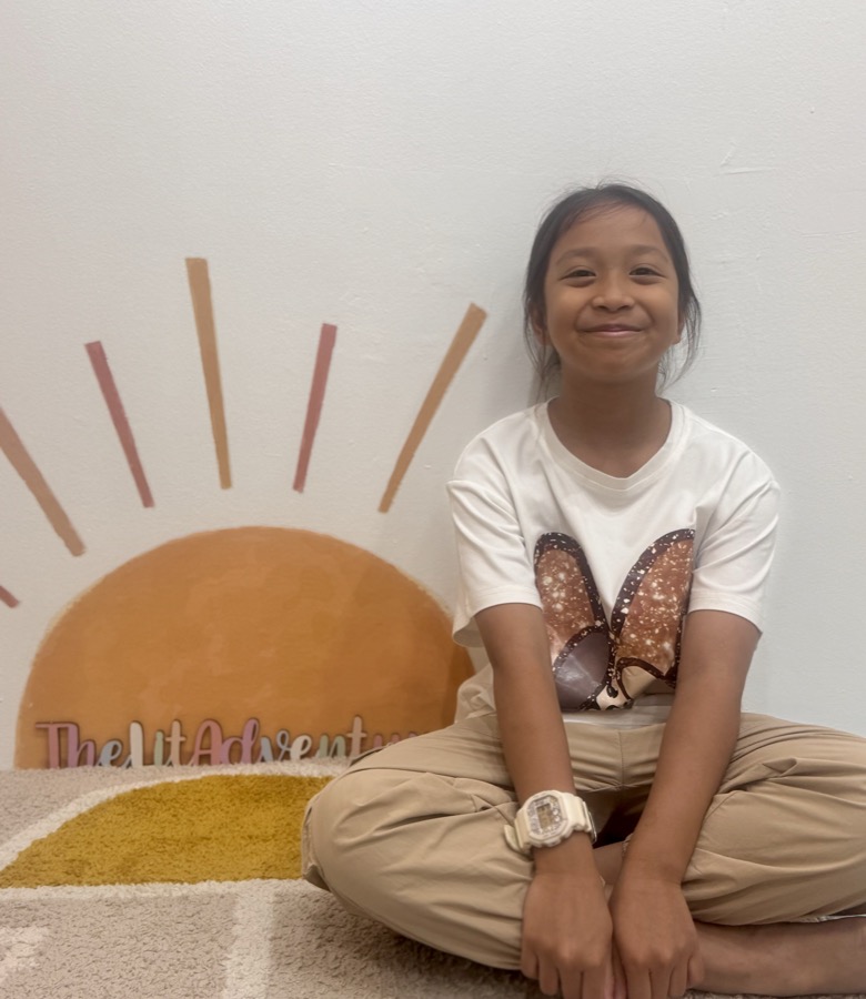 Student smiling at The Lit Adventure's Alexandra Central Mall classroom