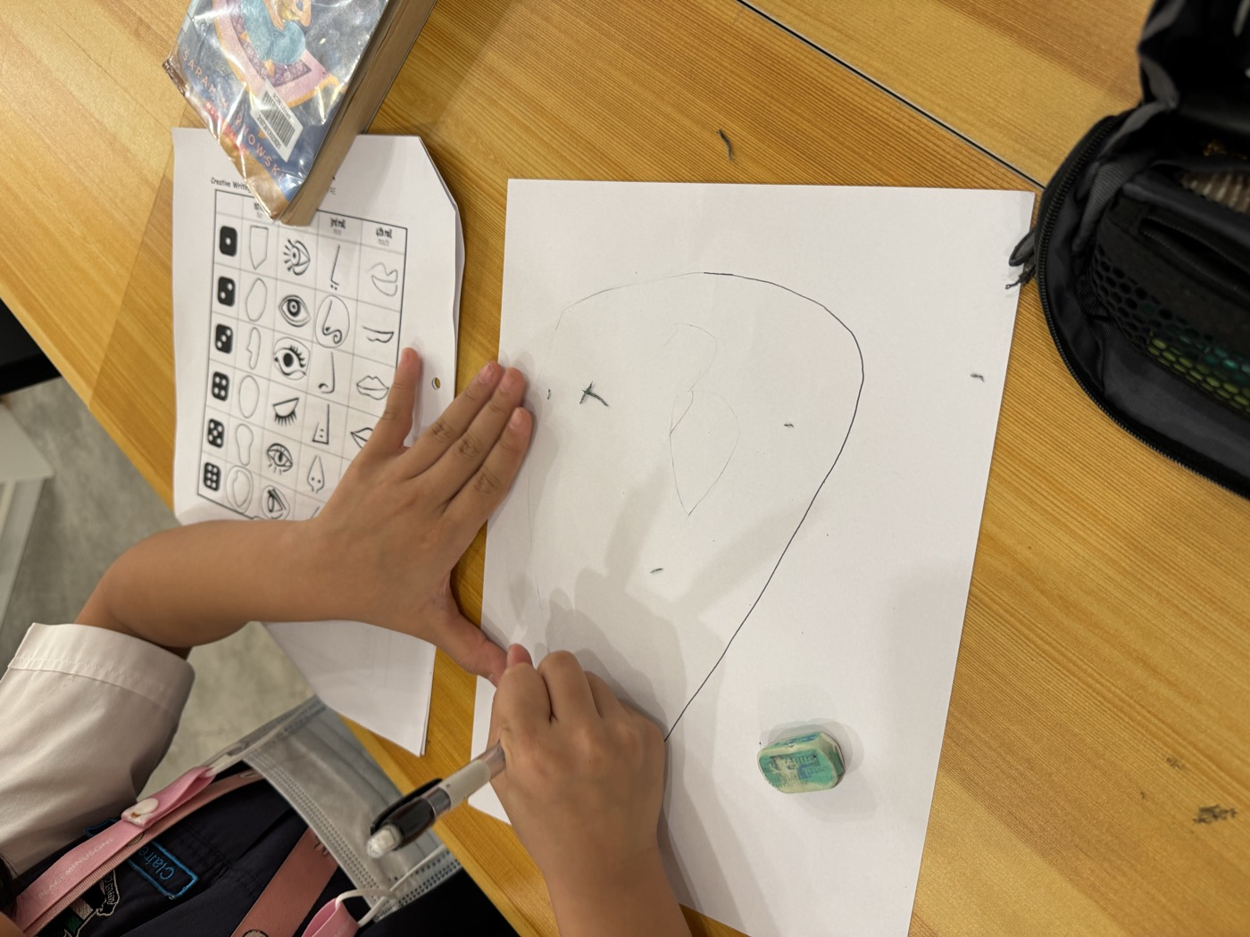 Student painting an Emotions Wheel, an art therapy activity used before writing