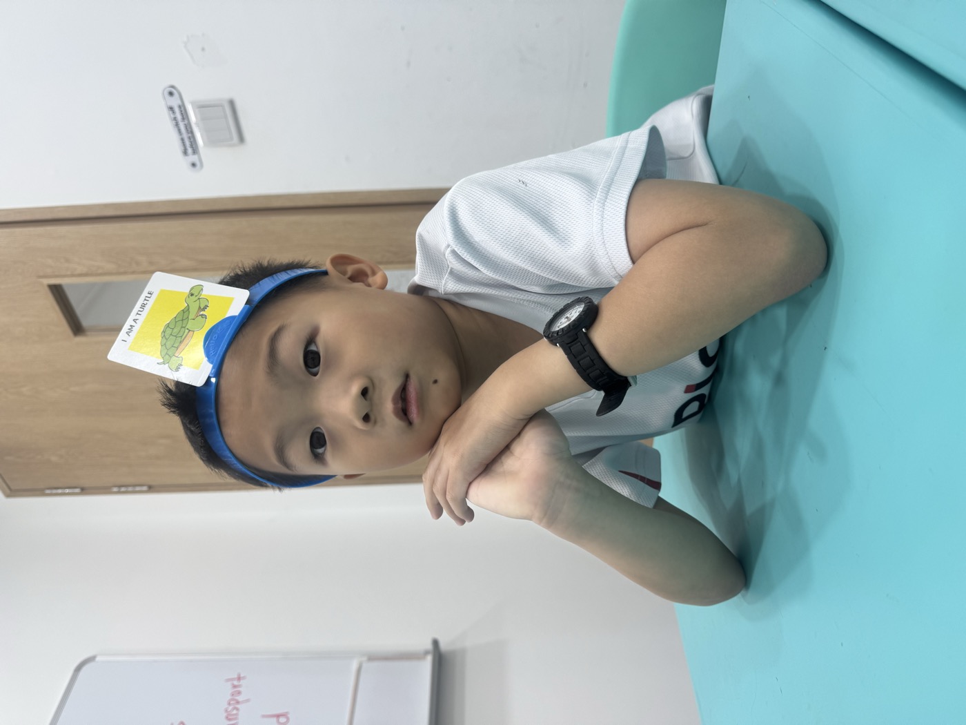 Young student working with alphabet letter tiles
