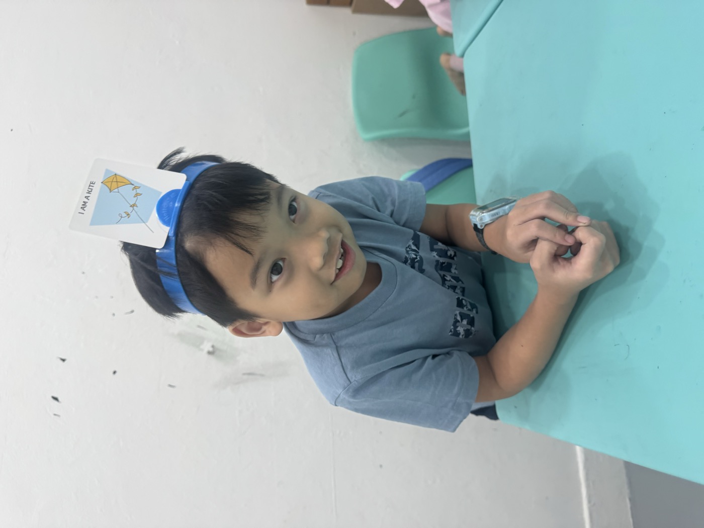 Preschool student working with alphabet letter tiles