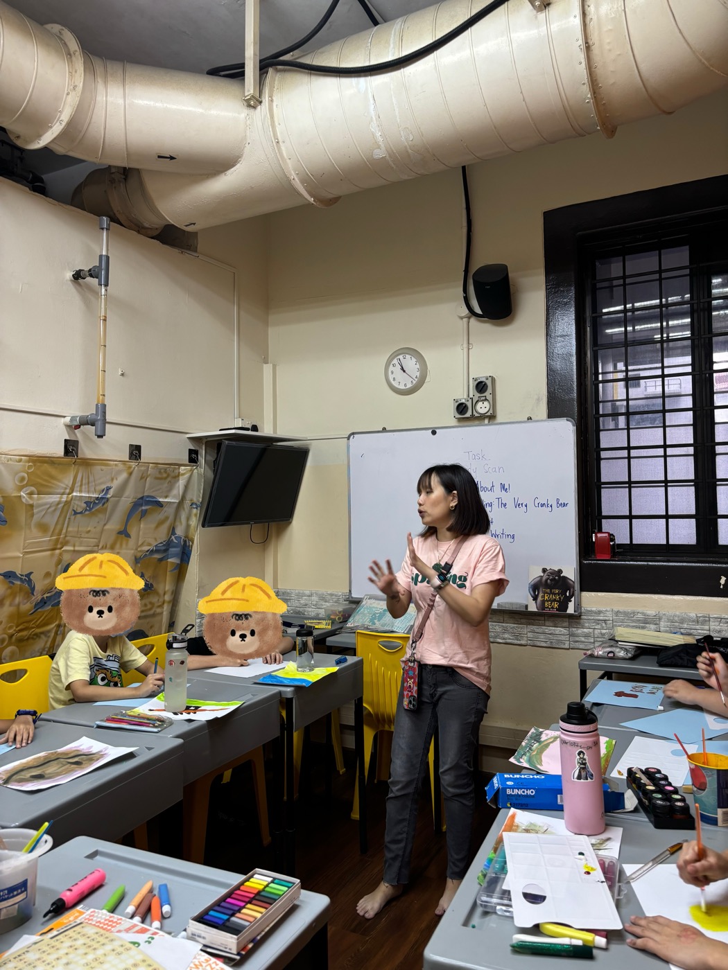 Ms Eileen teaching a creative writing lesson on-site at a partner student care centre