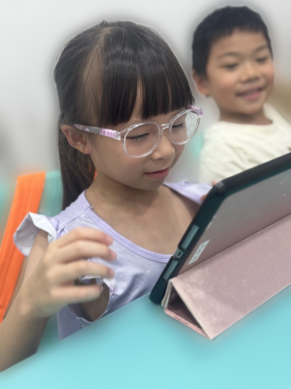 Primary student reading on a tablet during a TLA Prism lesson