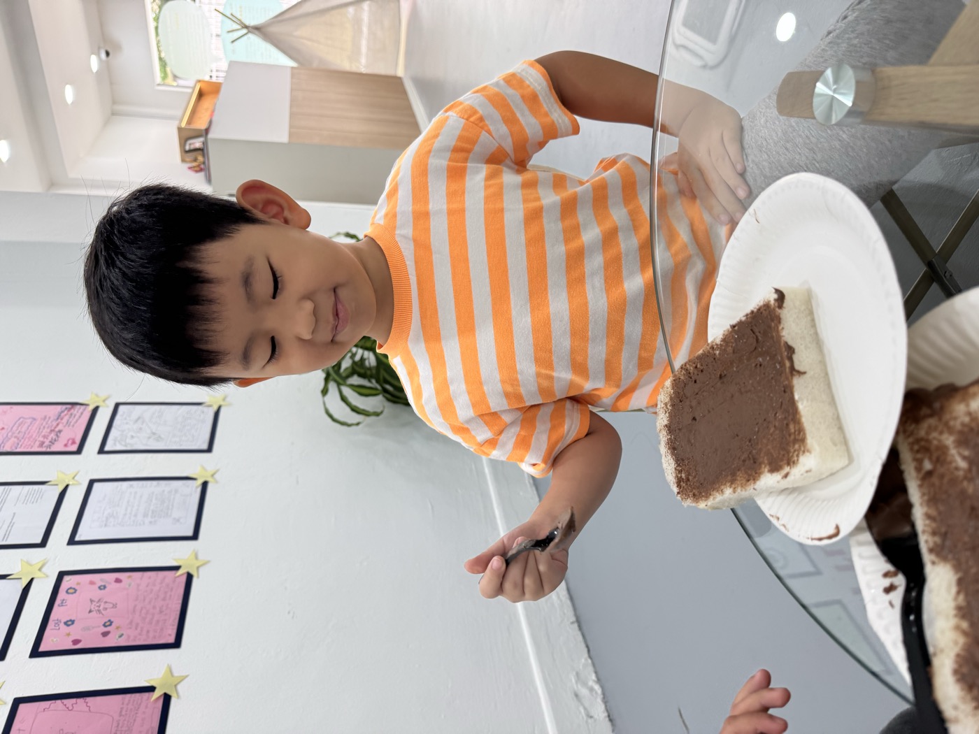 Student smiling during a snack-making activity at The Lit Adventure