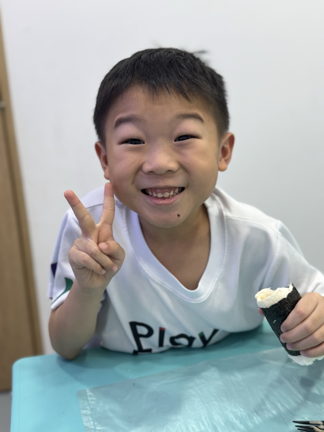 Student smiling during snack break in class
