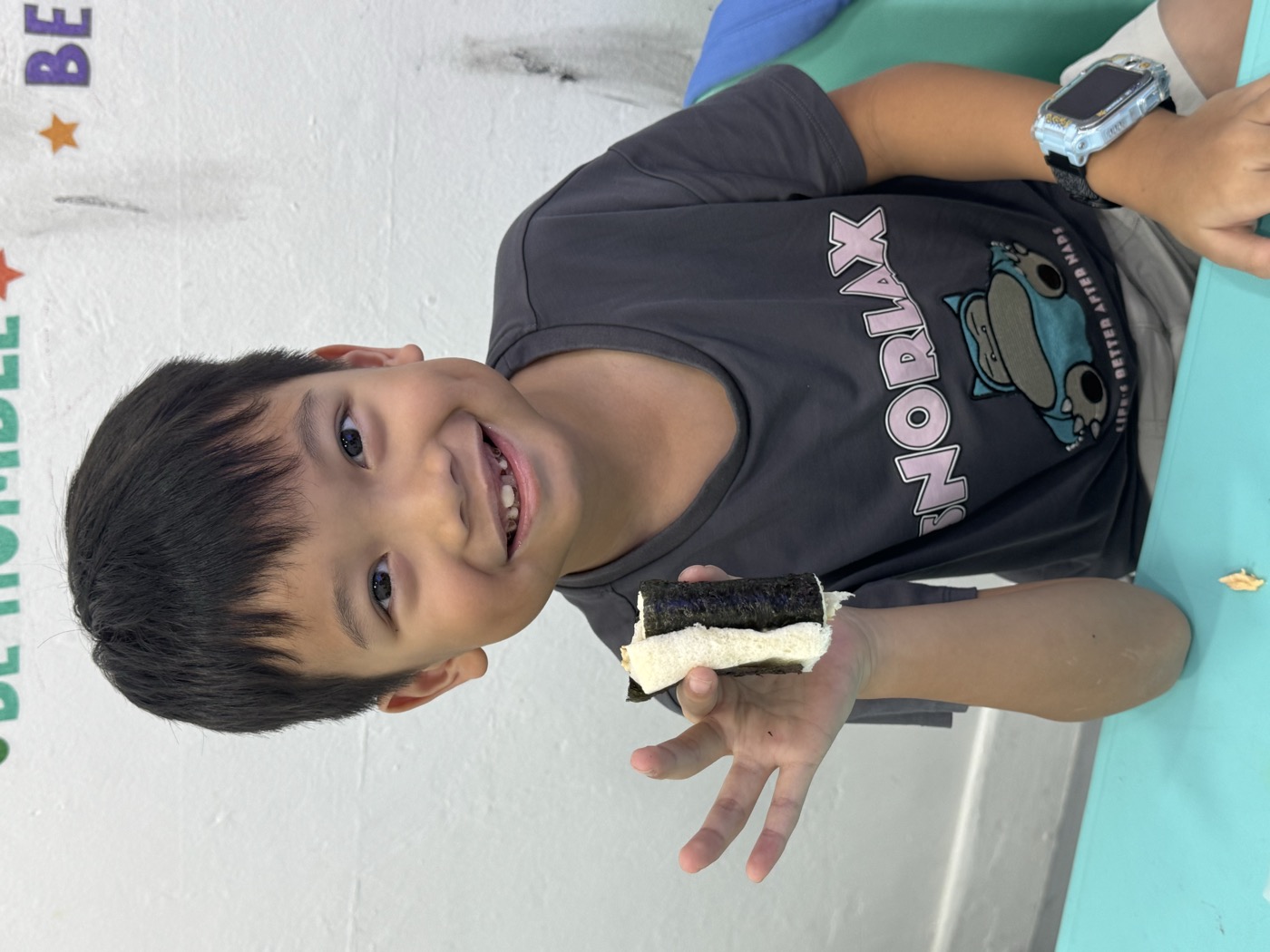 Student smiling during snack break in class