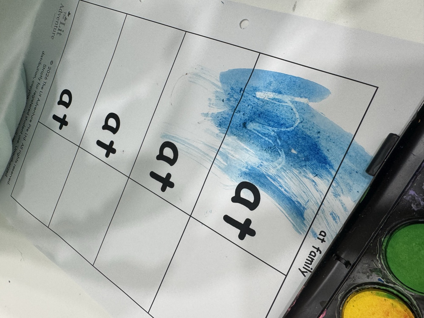 Student working through a coloured phonics worksheet